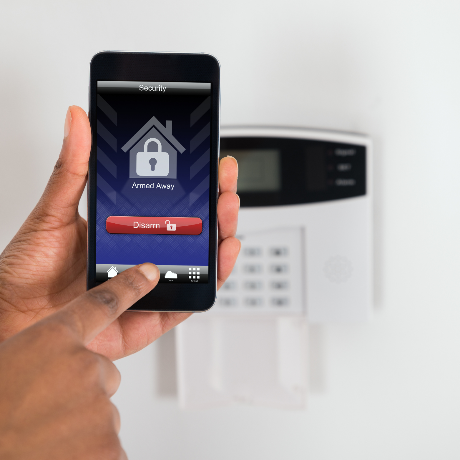 Hand holding Smartphone with Alarm Access options