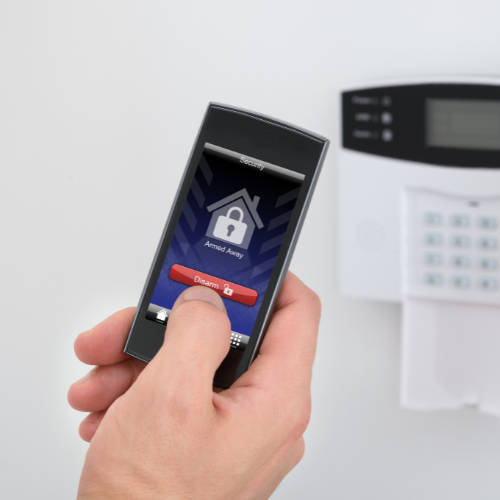 Person Disarming Alarm from Phone